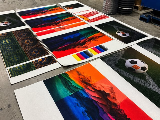 Custom printed mat samples in a production facility